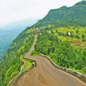 Curving mountain road passing through the green hills of Don Hill Station in Dang, Gujarat