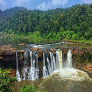 Wide view of Gira Waterfall surrounded by forests in Dang district, Gujarat